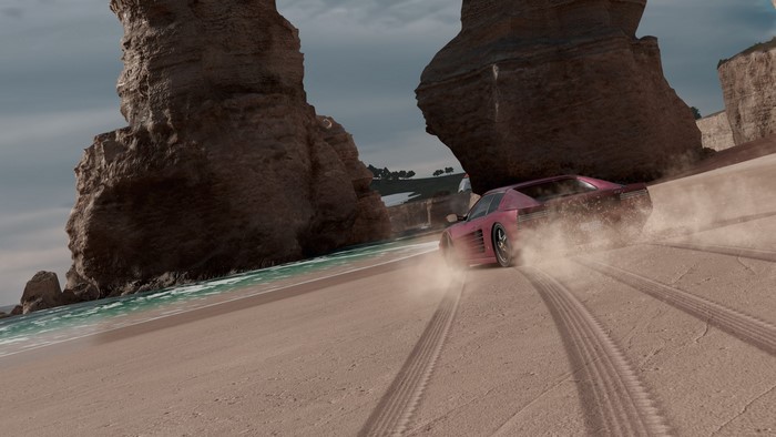 Ferrari drifting on a beach in Forza Horizon 3