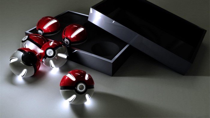 Collection of illuminated Pokéballs and a storage box