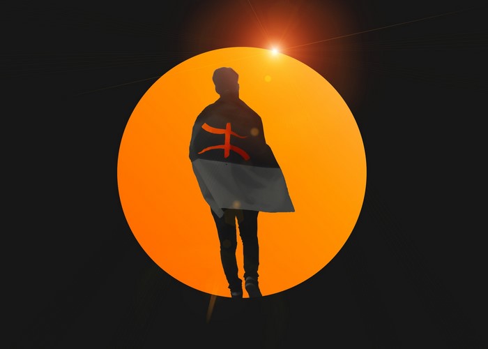 Person with flag in front of orange circle