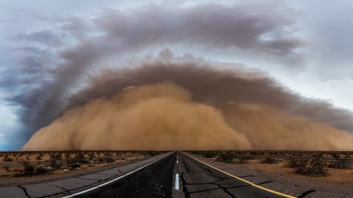 Dust storm approaching on a desert highway