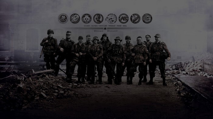 Group of men in military uniforms with logos