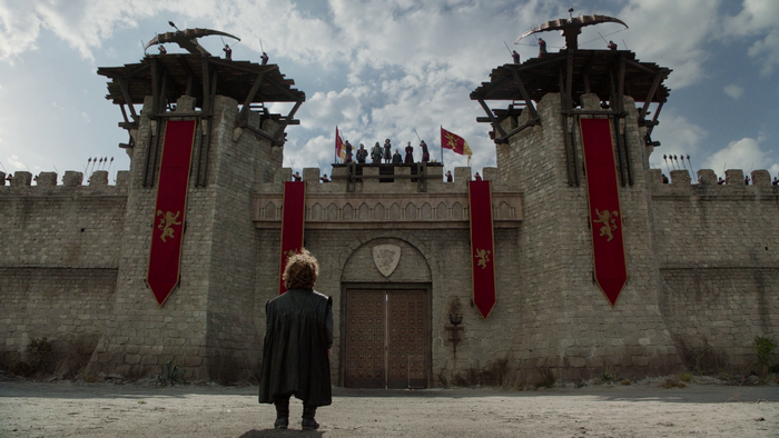 Tyrion Lannister from Game of Thrones at castle gates