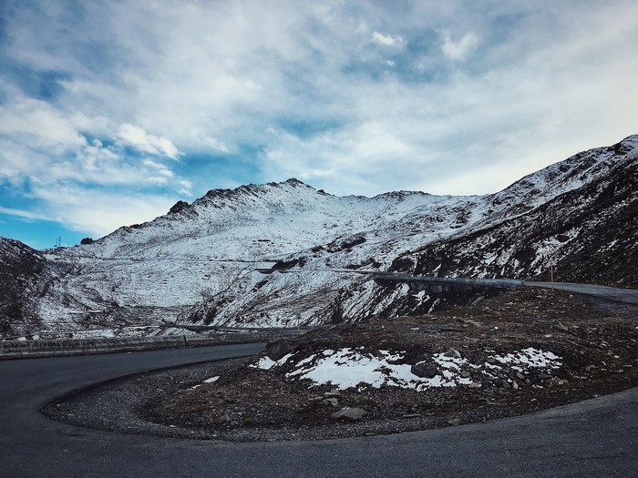 Snowy mountains with a winding road