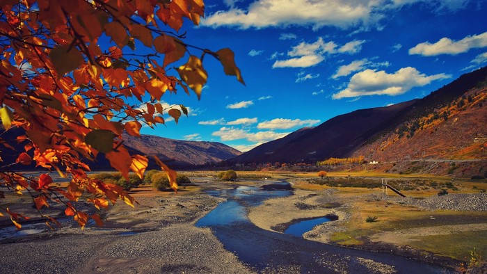 Autumn landscape with mountains and a river