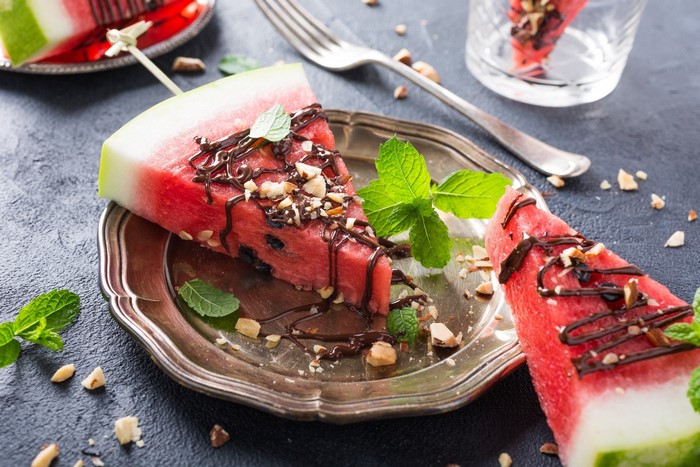 Watermelon slices with chocolate and nuts