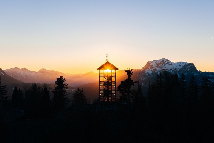 Observation tower in mountains at sunset