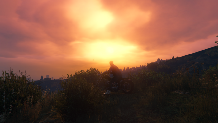 Man on motorcycle at sunset in Grand Theft Auto V