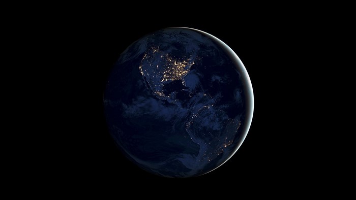 Earth at night from space showing North and South America