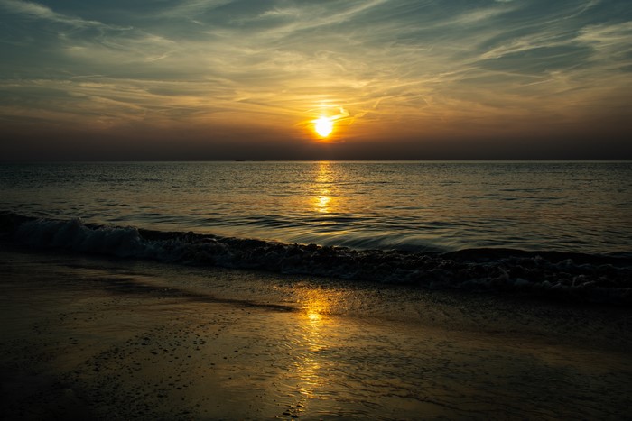 Sunset over the sea with beach