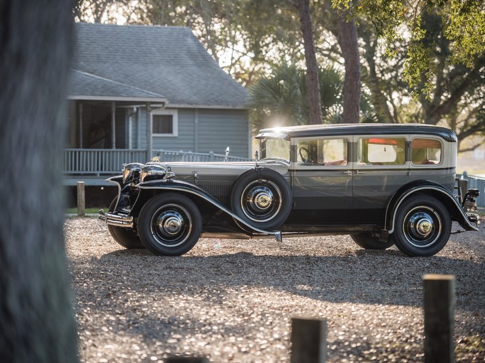 Ruxton Model C classic car parked near a house