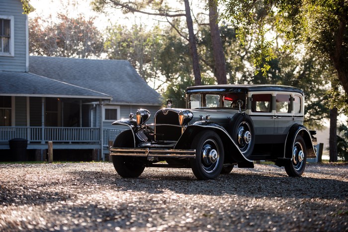 Ruxton Model C classic car parked near a house