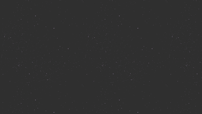 Dark background with scattered white dots and specks