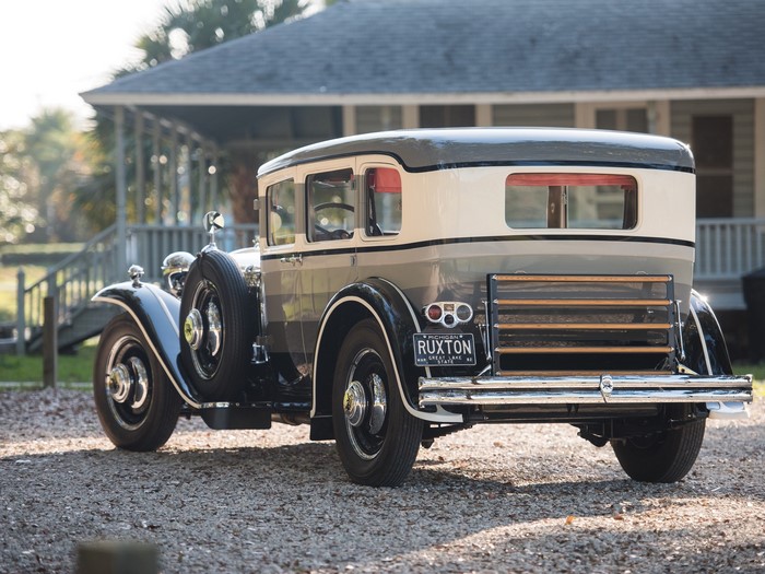 Ruxton Model C classic car parked in front of a house