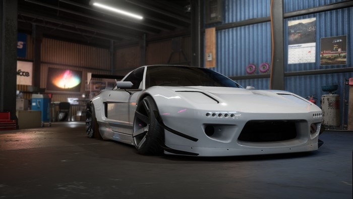 White Honda NSX with Rocket Bunny kit in a garage