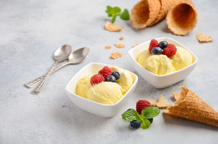 Vanilla ice cream with berries and waffle cones