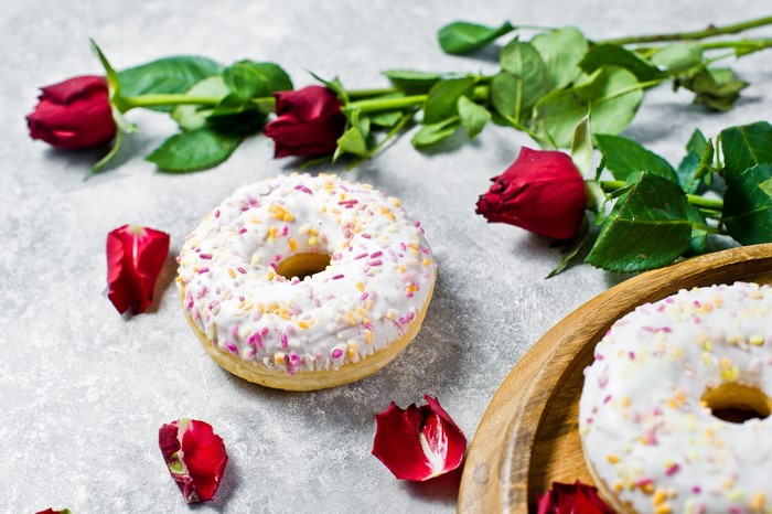 Donuts with red roses and petals