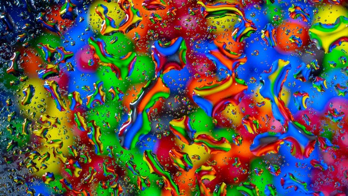 Colorful water drops on M&M candies