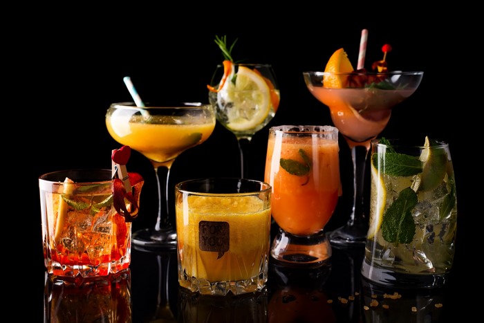 Assortment of colorful cocktails on a black background