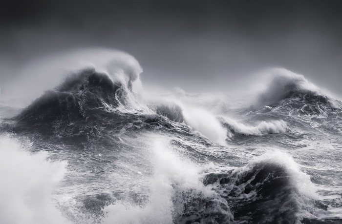 Monochrome storm waves crashing in the sea