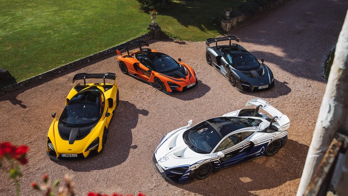 Four McLaren Senna supercars parked on gravel