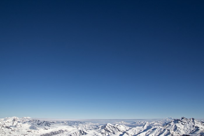 Snowy mountains under a clear blue sky