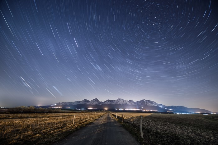 Star Trails Over Mountains at Night