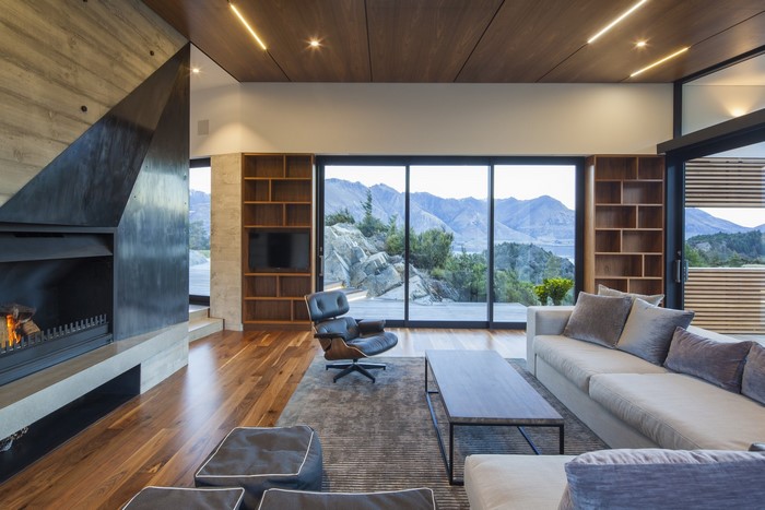 Modern living room with fireplace and mountain view
