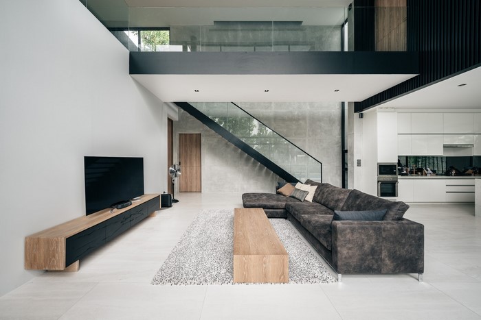 Modern living room with sectional sofa and kitchen