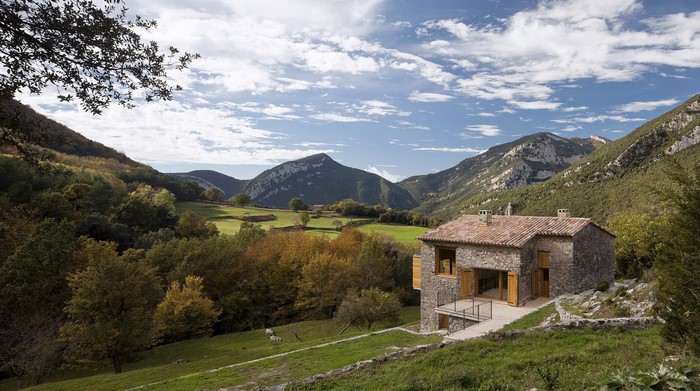 Stone house in a mountain valley during autumn