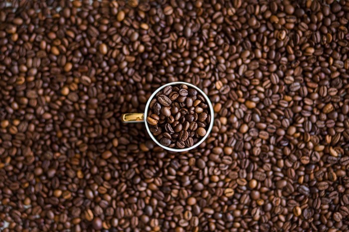Top view of coffee beans in a cup