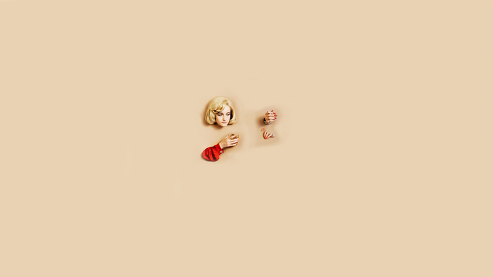 Woman's head and hands emerging from a peach background