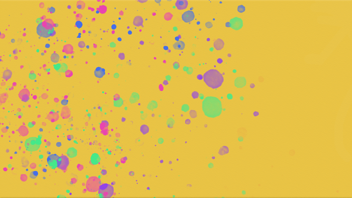 Colorful paint splashes on a yellow background