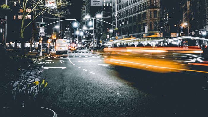 Long exposure of a city street at night with blurred car lights
