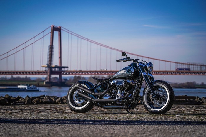 Custom Harley Davidson motorcycle by a bridge