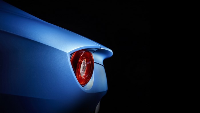 Blue Ferrari F12berlinetta taillight on black background