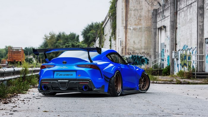 Blue Toyota Supra with large rear spoiler