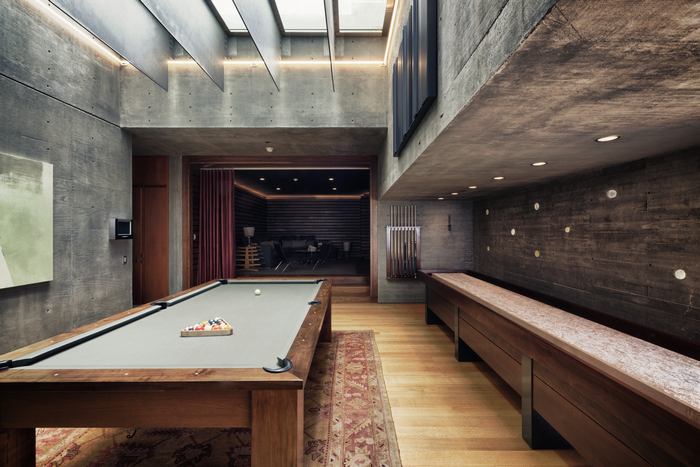 Modern game room with pool table and shuffleboard
