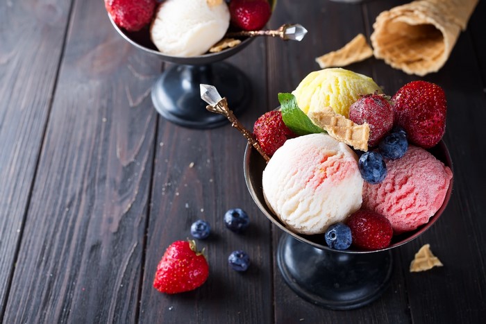 Ice cream sundaes with berries and waffle cones