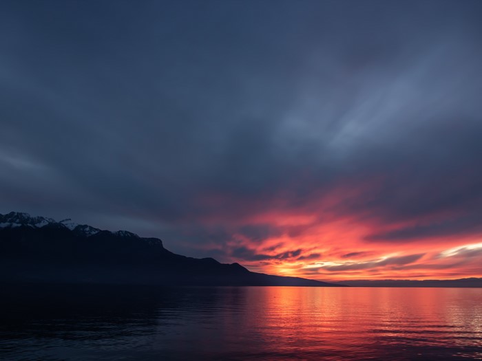 Sunset over Lake Geneva with Swiss Alps