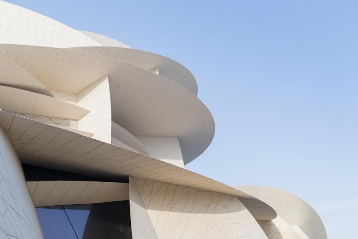 National Museum of Qatar architecture against clear sky