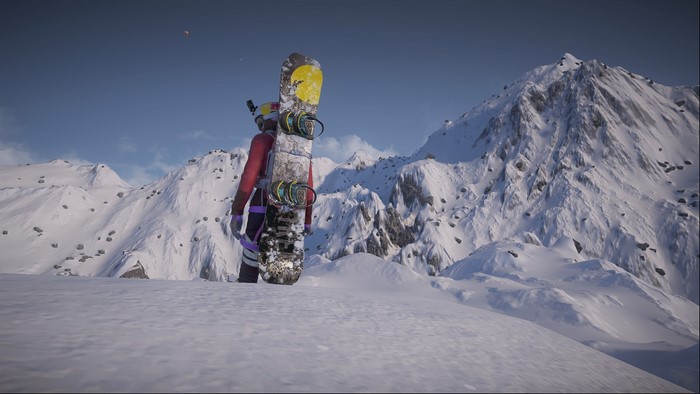Snowboarder in snowy mountains