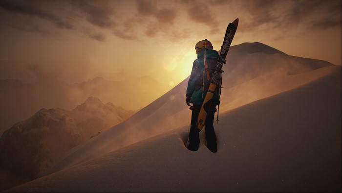 Skier on a snowy mountain at sunset