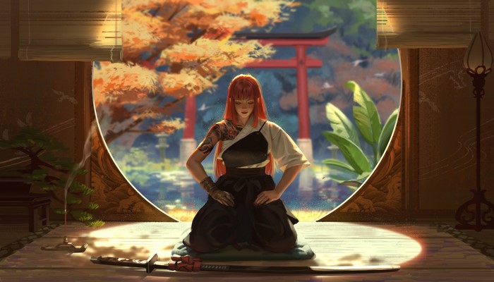 Woman with tattoos meditating in a Japanese garden