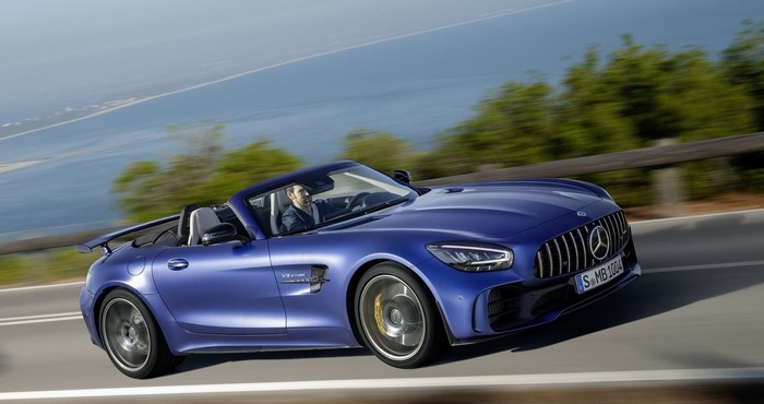 Blue Mercedes-Benz AMG GT-R Roadster driving on a coastal road