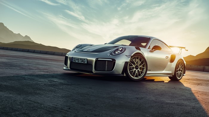 Silver Porsche 911 GT2 RS on a road