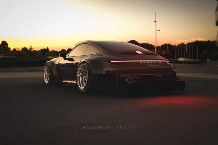 Black Porsche 911 Carrera S at sunset