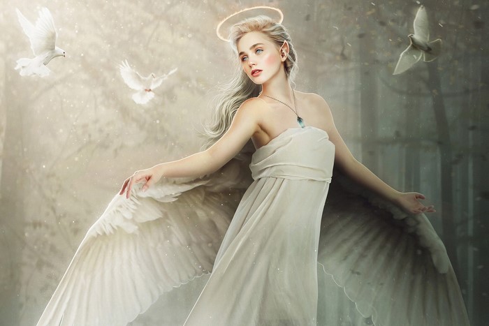 Angel with wings and halo surrounded by doves