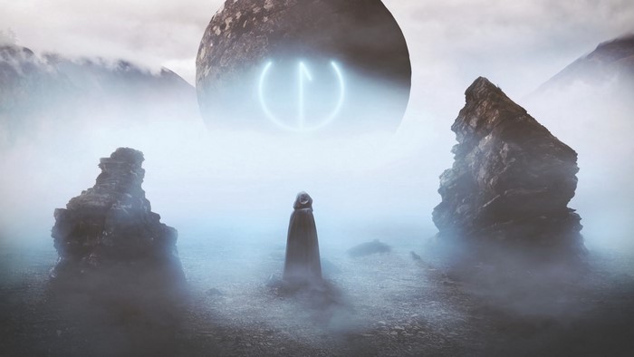 Figure in a hooded cloak before a glowing orb and rocks