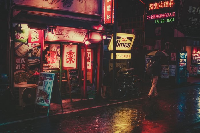 Japanese restaurant at night with neon signs