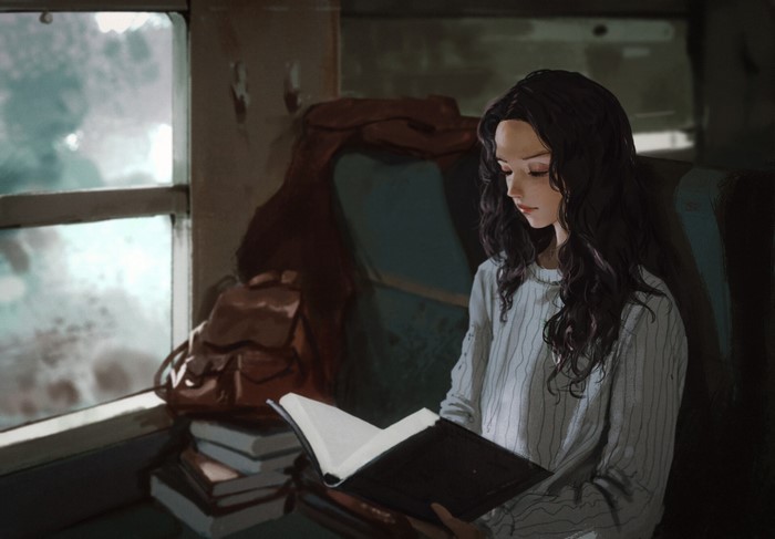 Rui Li reading a book on a train